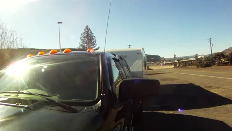 Driving, an RV and pickup make a U-turn on Hwy 97, Oregon, at Columbia River, Stock Footage 167182926