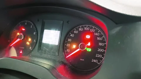 Driving safely with illuminated dashboard lights, showing car's speed and 動画素材 318317294