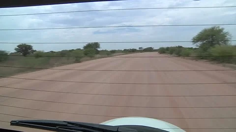Driving in savannah with many dust Stock Footage 56467971