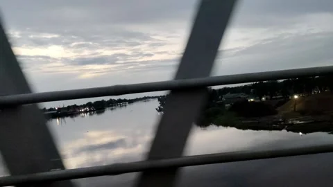 A Driving Scene with a River View from a Quiet Bridge Video stock 304718498