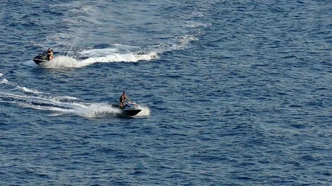 Driving a Scooter at a Seaside Stock-Footage 80668776