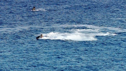 Driving a Scooter at a Seaside Stock-Footage 80669487