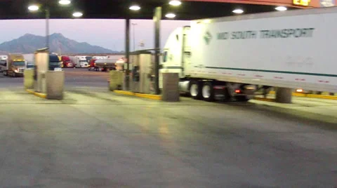 Driving By Semi Tractor Trailer Trucks At Truck Stop Gas Pumps Stock Footage