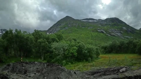 Driving shot past mountain river stream and birch forest in Norway Stock-Footage 343833860