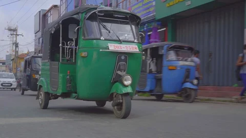 Driving side plate with view of keke napep and stores Stock Footage 107537254