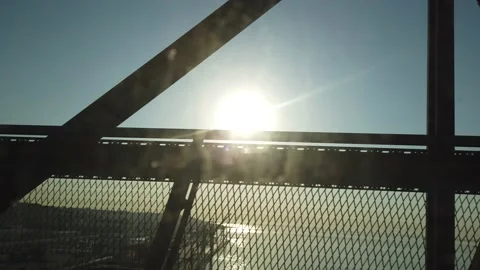 Driving side-view of bridge at sunrise in Lisbon, Portugal during summer time. Stock Footage 150840614