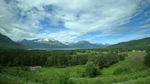 Driving side window view of Narvik and Tromso E6 road sign in Northern Norway Stock-Footage 340960140