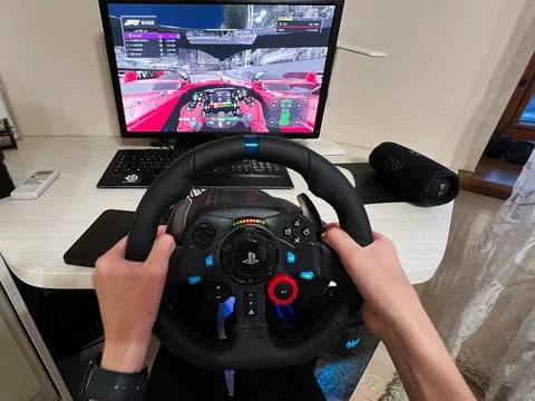 Driving Simulation F1 race Setup with Steering Wheel and Racing Video Game .. Stock Photos