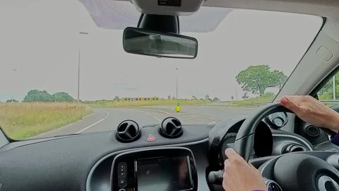 Driving in a small car Video stock 249548267