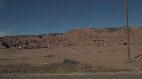 Driving by Small Desert Dwelling in Slow Motion Stock Footage 50440383