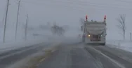 Driving In Snow And Blizzard Behind A Snow Plow On The Highway Stock Footage