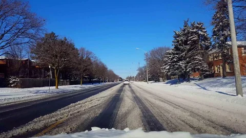 Driving on Snow Covered Road in Day Stock Footage 101490237