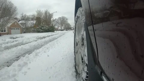 Driving in the snow low angle tire shot. Stock Footage 229671488