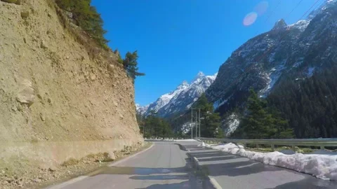 Driving at Snow mountain road Stock Footage 220697672