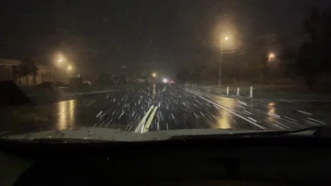 Driving in Snow at Night Stock Footage 264638800