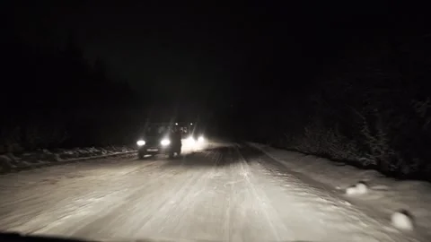 Driving on snow road in forest at night. POV Stock Footage 263195467