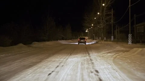 Driving on snow road in forest at night. POV Stock Footage 263195472