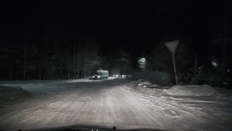 Driving on snow road in forest at night. POV Stock Footage 263304265