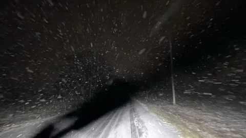 Driving in a snow storm at night Stock Footage 301924523