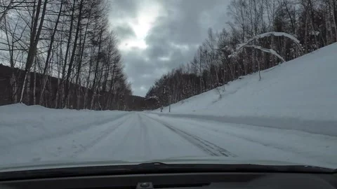 Driving Snowy Mountain Road with Light Snowfall Hokkaido Winter Stock Footage 333370492