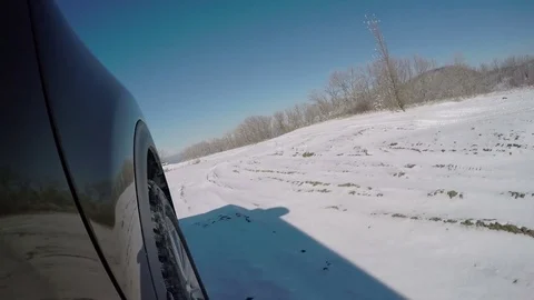 Driving on snowy off road Stock Footage 72044380