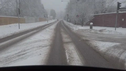 Driving on a snowy road Stock Footage 168145446