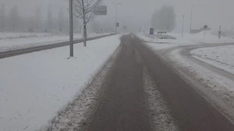 Driving snowy road Stock Footage 168145573