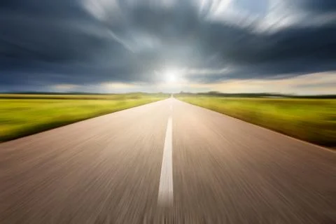 Driving speed on an empty aspalt road 写真素材