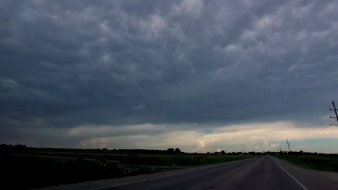 Driving by storm clouds Stock Footage 92378839
