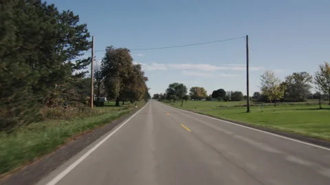Driving straight on a flat road in a typical American agricultural region Stock Footage 165800778
