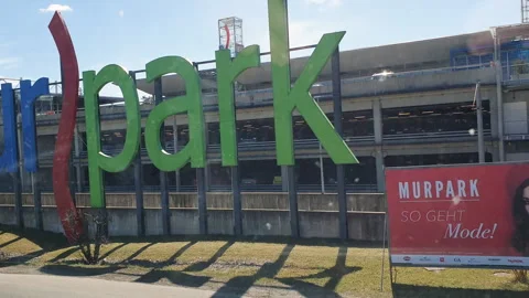 Driving on the streets of Graz View from a bus MurPark Shopping Center Exterior Stock Footage 331660438