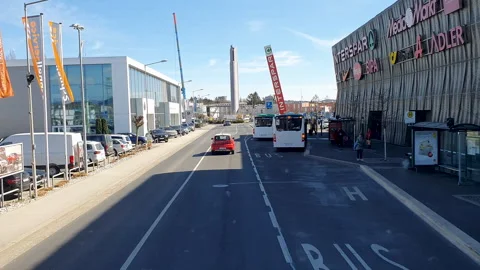 Driving on the streets of Graz View from a bus MurPark Shopping Center Exterior Stock Footage 331660444