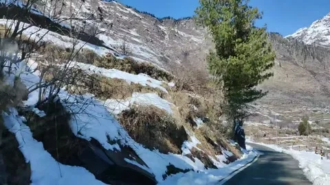 Driving on streets of mountains in between fresh Snow Stock Footage 159633349