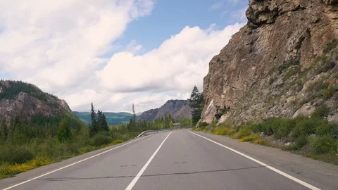 Driving on a summer mountain road Stock Footage 93200258