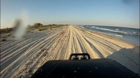Driving at sunset, on the beach Stock-Footage 14808348