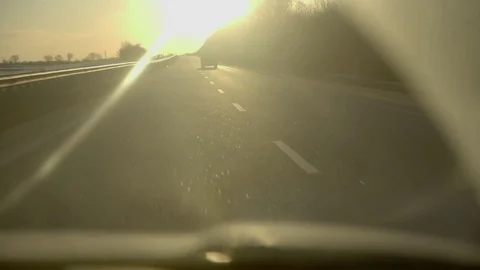 Driving into a sunset on highway with flare Stock Footage 73107116
