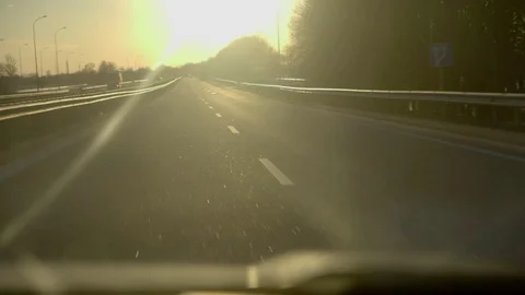 Driving into a sunset on highway with flare Stock Footage 73107130