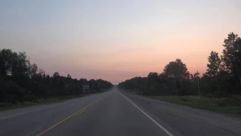 Driving into the Sunset A Tranquil Drive Through the Countryside Stock Footage 348217279