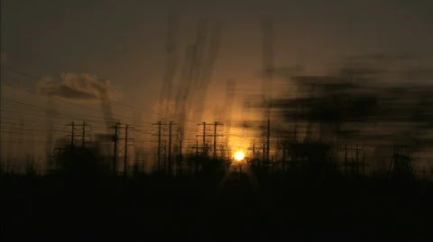Driving sunset trees electric pole Stock Footage 624112