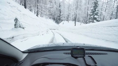 Driving a suv car trough deep snow Stock Footage 103210297