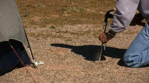 Driving a Tent Stake Video stock 74652