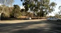 Driving Three Quater Rear 09 Street by a park HD Footage