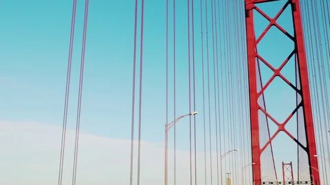 Driving through 25 April bridge in Lisbon at evening ,glidecam Stock Footage 78318874