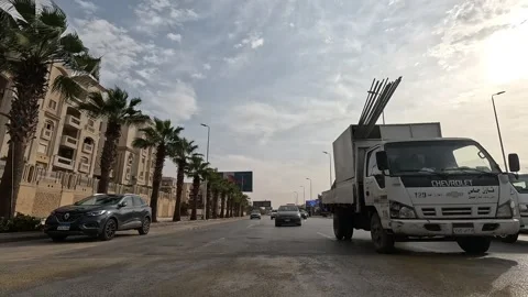 Driving Through Active Urban Residential Streets New Cairo Showing Buildings Stock Footage 329764099
