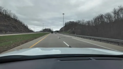 Driving Through Appalachian Mountains in Spring Under Cloudy Sky Stock Footage 332382577