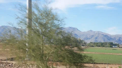 Driving Through Arizonas Desert Landscape With Mountain Views Stock Footage 268651197