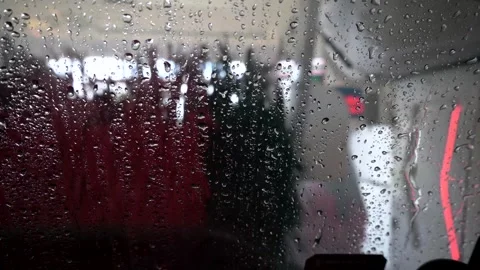 Driving through the automated full service car wash to get clean Stock Footage 303627126