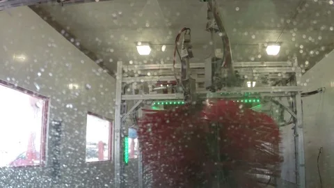 Driving through an automatic indoor car wash Stock Footage 70443056