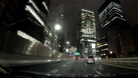 Driving through bright buildings in Shibuya area, Tokyo Stock Footage