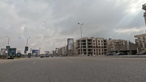 Driving Through Bright City District Streets New Cairo Showing Buildings Traffic Stock-Footage 330108266